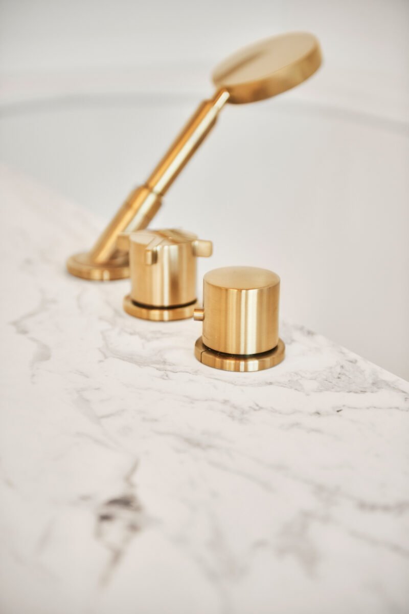 interior design bright bathroom marble white gold bath tap